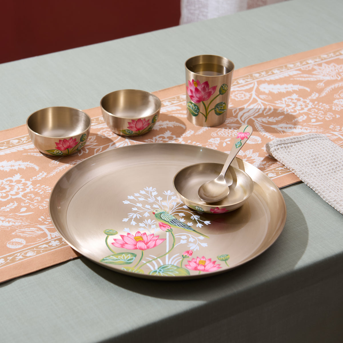 Hand-painted Parrot & Lotus kansa set on the table