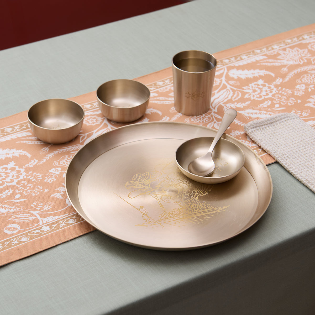 Boatman Motif kansa dinner set on the table